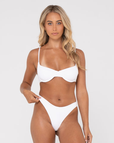 Woman wearing Sandalwood Brazilian Bikini Pant in Bright White