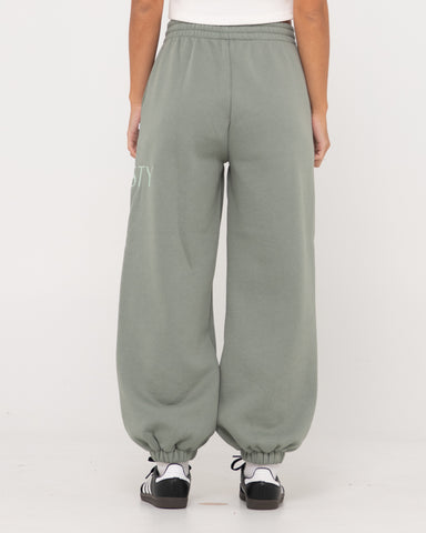 Woman wearing Rusty Signature Oversize Trackpant in Faded Pistachio