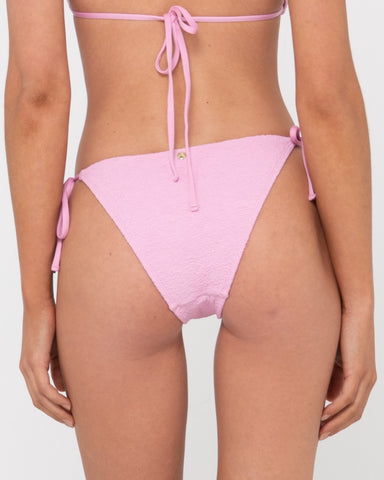 Woman wearing Sandalwood Midi Side Ties Bikini Pant in Fondant Pink