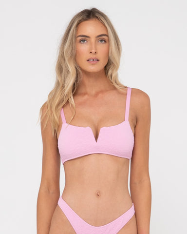 Woman wearing Sandalwood Bralette Bikini Top in Fondant Pink