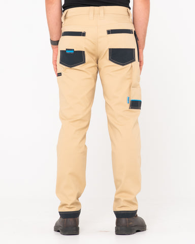 Man wearing Tr245 9 Pocket Stretch Work Pant in Trade Khaki
