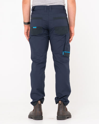 Man wearing Tr245 9 Pocket Stretch Work Pant in True Navy