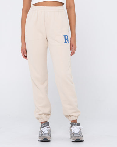 Woman wearing Rusty Line Trackpant in Coconut Cream