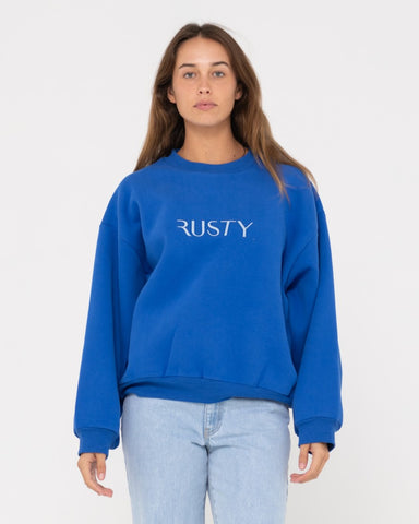 Woman wearing Rusty Signature Oversize Crew Fleece in Blue Sapphire
