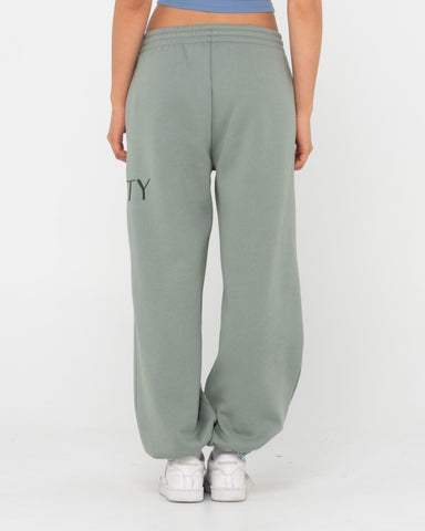 Woman wearing Rusty Signature Oversize Trackpant in Faded Pistachio