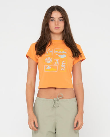 Woman wearing Le Sol Short Sleeve Skimmer Baby Tee in Apricot Blush