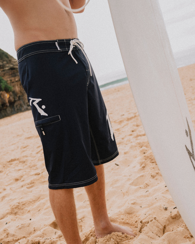 Man wearing Fixed Competition Revolution Boardshort in Navy Blue