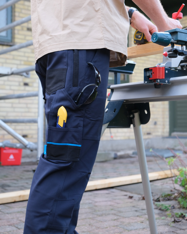 Man wearing Tr245 9 Pocket Stretch Work Pant in True Navy