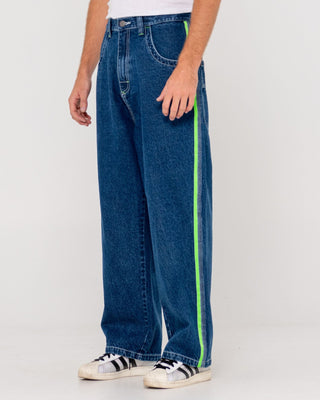 Man wearing Reflekt Baggy Jean in Deep Sea Blue / Lime