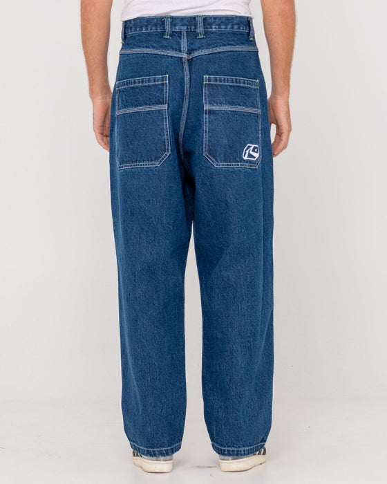 man-wearing-reflekt-baggy-jean-in-deep-sea-blue-lime