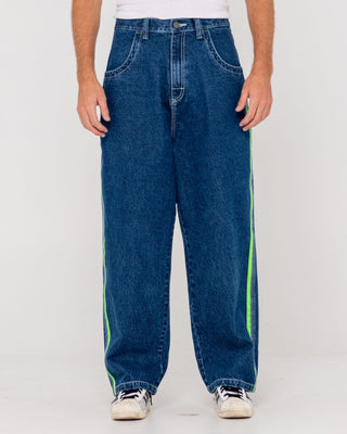 Man wearing Reflekt Baggy Jean in Deep Sea Blue / Lime