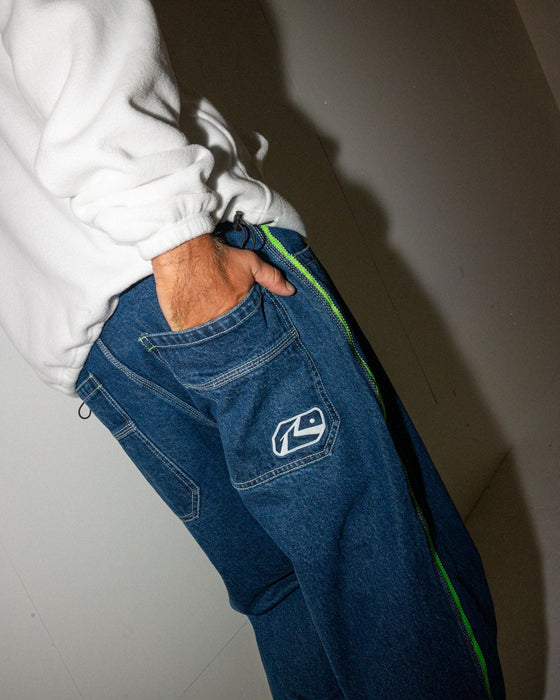 man-wearing-reflekt-baggy-jean-in-deep-sea-blue-lime