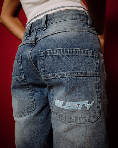 Woman wearing Flip Mommy Low Rise Wide Leg Denim Jort in Blasted Middy Blue