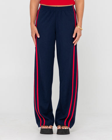 Woman wearing Bronson Low Rise Trackpant in Navy Blue