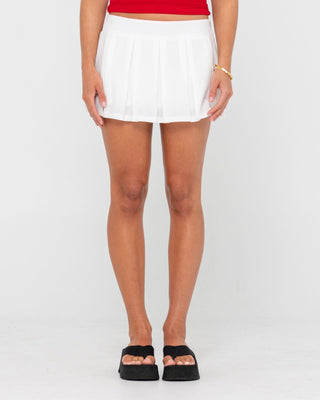 Woman wearing Luv One Pleated Low Rise Mini Skirt in Off White