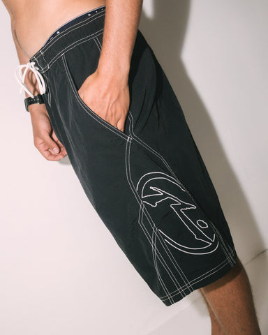 Man wearing Tombstones Hybrid Waist Boardshort in Black