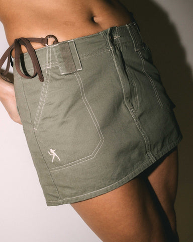 Woman wearing Dirtbag Cargo Low Rise Mini Skirt in Brown