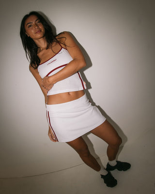 Woman wearing Freo King Low Rise Mini Skirt in White