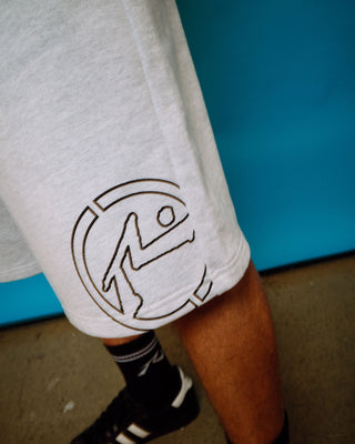 Man wearing Flip Track Short in Ecru Marle