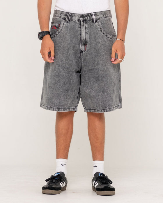 man-wearing-stitch-up-jort-in-washed-black