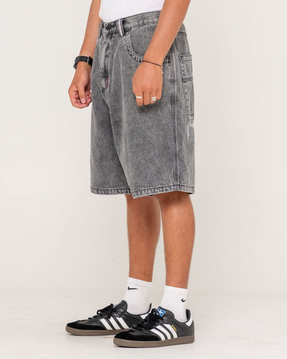 man-wearing-stitch-up-jort-in-washed-black