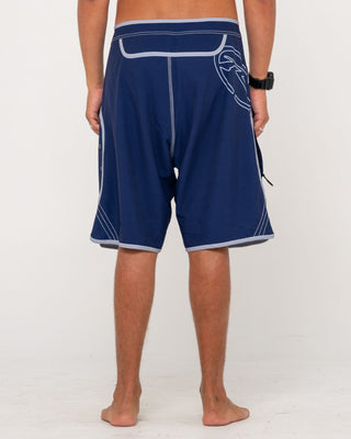 Man wearing Voltron Fixed Waist Boardshort in Dark Blue