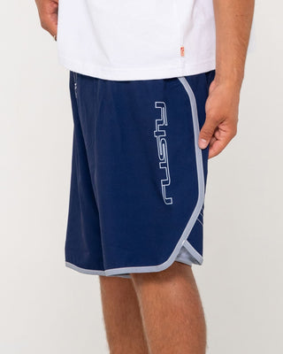 Man wearing Voltron Fixed Waist Boardshort in Dark Blue