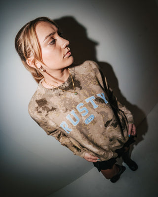 Woman wearing Camoozy Knitted Crew in Camo