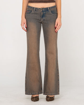 Woman wearing Lucky Number Low Rise Flare Jeans in Rusty Overdye