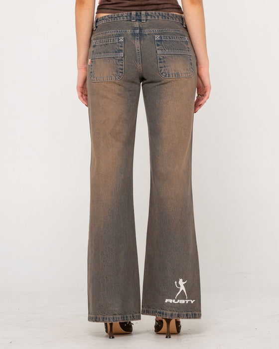 woman-wearing-lucky-number-low-rise-flare-jeans-in-rusty-overdye