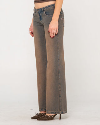 Woman wearing Lucky Number Low Rise Flare Jeans in Rusty Overdye