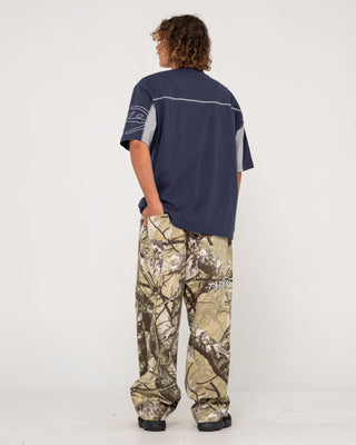Man wearing Hoodus Rambo Baggy Pant in Camo