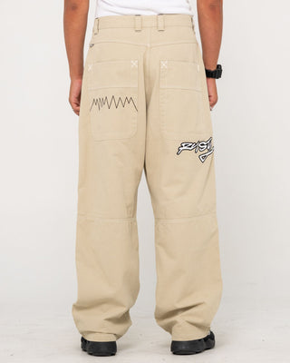 Man wearing Step-stone Baggy Pant in Abbey Stone