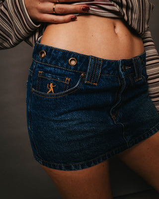 Woman wearing Blasted Eye Let Loose Denim Micro Skirt in Blasted Deep Sea Blue