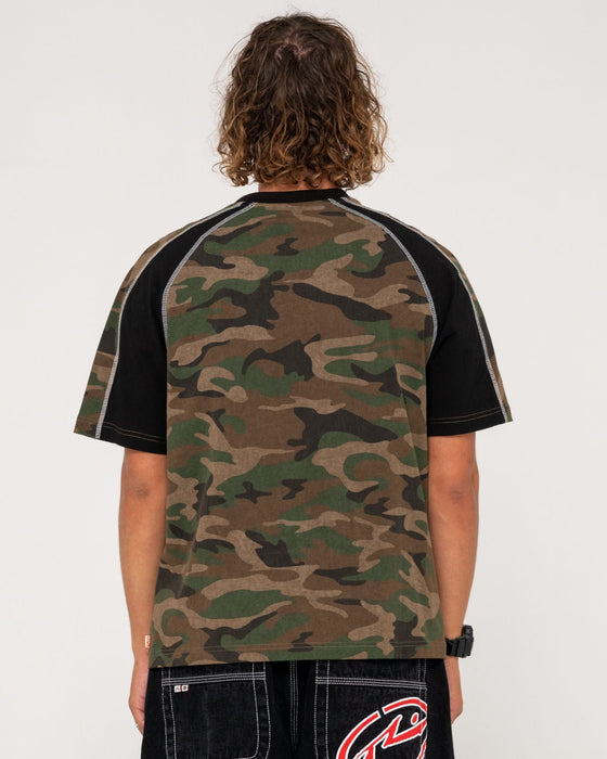 man-wearing-woof-raglan-short-sleeve-tee-in-camo