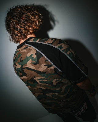 Man wearing Woof Raglan Short Sleeve Tee in Camo