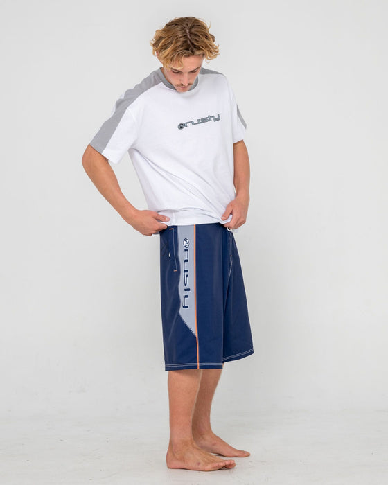 man-wearing-ghostface-fixed-waist-boardshort-in-dark-blue