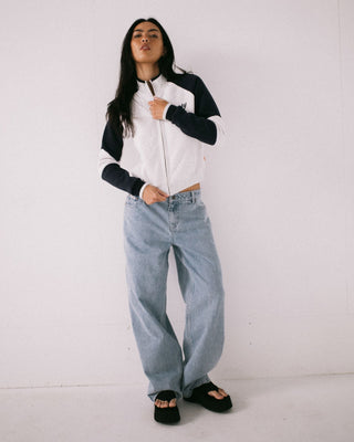 Woman wearing Day Dreamer Funnel Neck Fleece in Ecru Marle