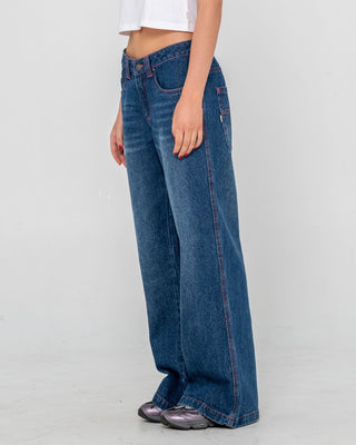 Woman wearing Colour Me Wendy Wide Low Rise Jeans in Blasted Deep Sea Blue