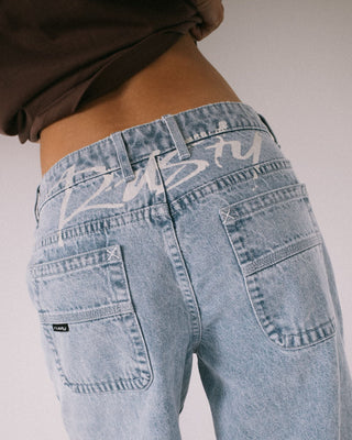 Woman wearing Gangsta Baggy Low Rise Jean in True Blue