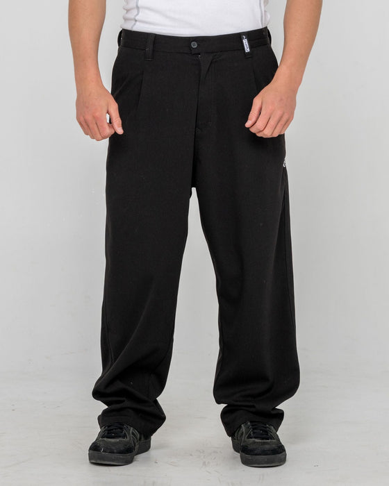 man-wearing-jasper-baggy-pleated-suit-pant-in-black
