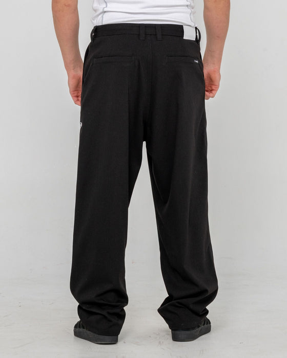 man-wearing-jasper-baggy-pleated-suit-pant-in-black