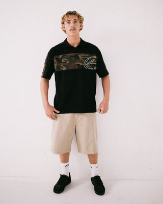 Man wearing Kill Switch Short Sleeve Polo in Black