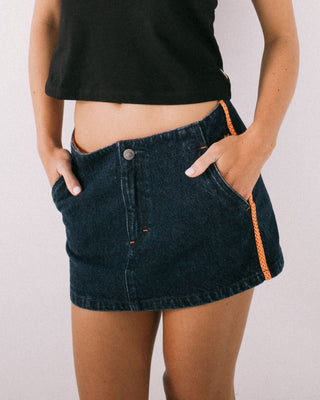 Woman wearing Webber Denim Low Rise Micro Mini Skirt in Indigo