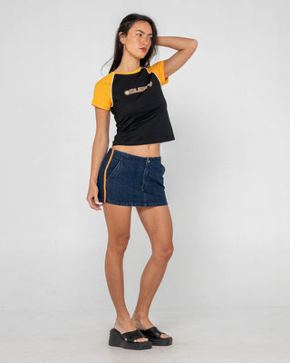 Woman wearing Archived Raglan Baby Tee in Black / Orange