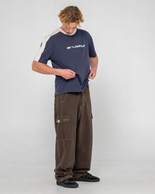 man-wearing-weapon-short-sleeve-tee-in-dark-blue