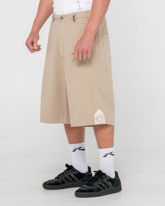 man-wearing-strikewear-baggy-twill-short-in-abbey-stone