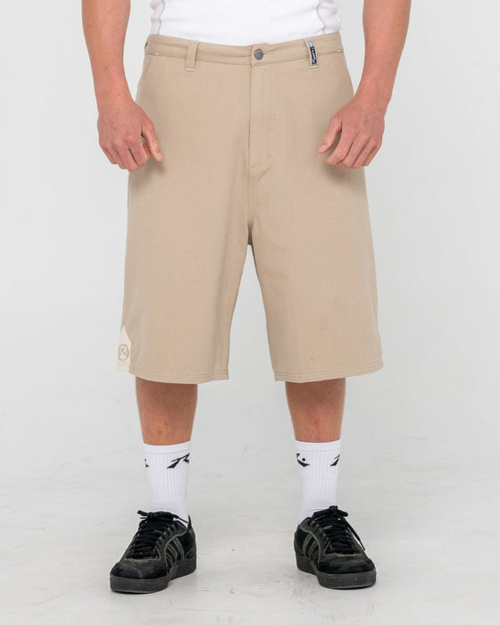 man-wearing-strikewear-baggy-twill-short-in-abbey-stone