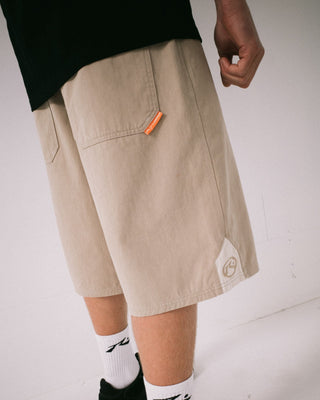 Man wearing Strikewear Baggy Twill Short in Abbey Stone