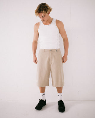 Man wearing Strikewear Baggy Twill Short in Abbey Stone
